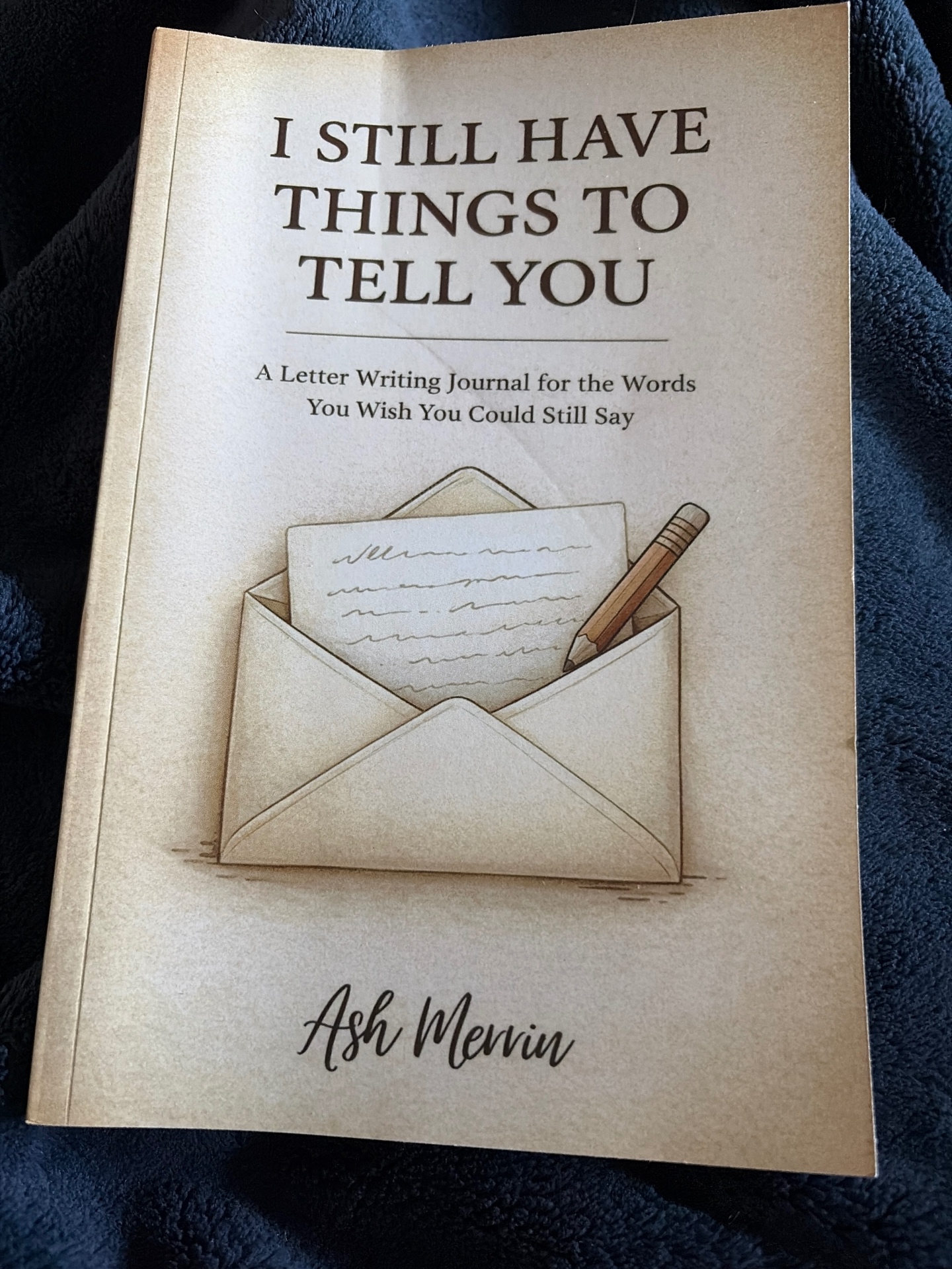 The letter-writing journal from My Favorite Books, photographed by Nina on a soft blanket